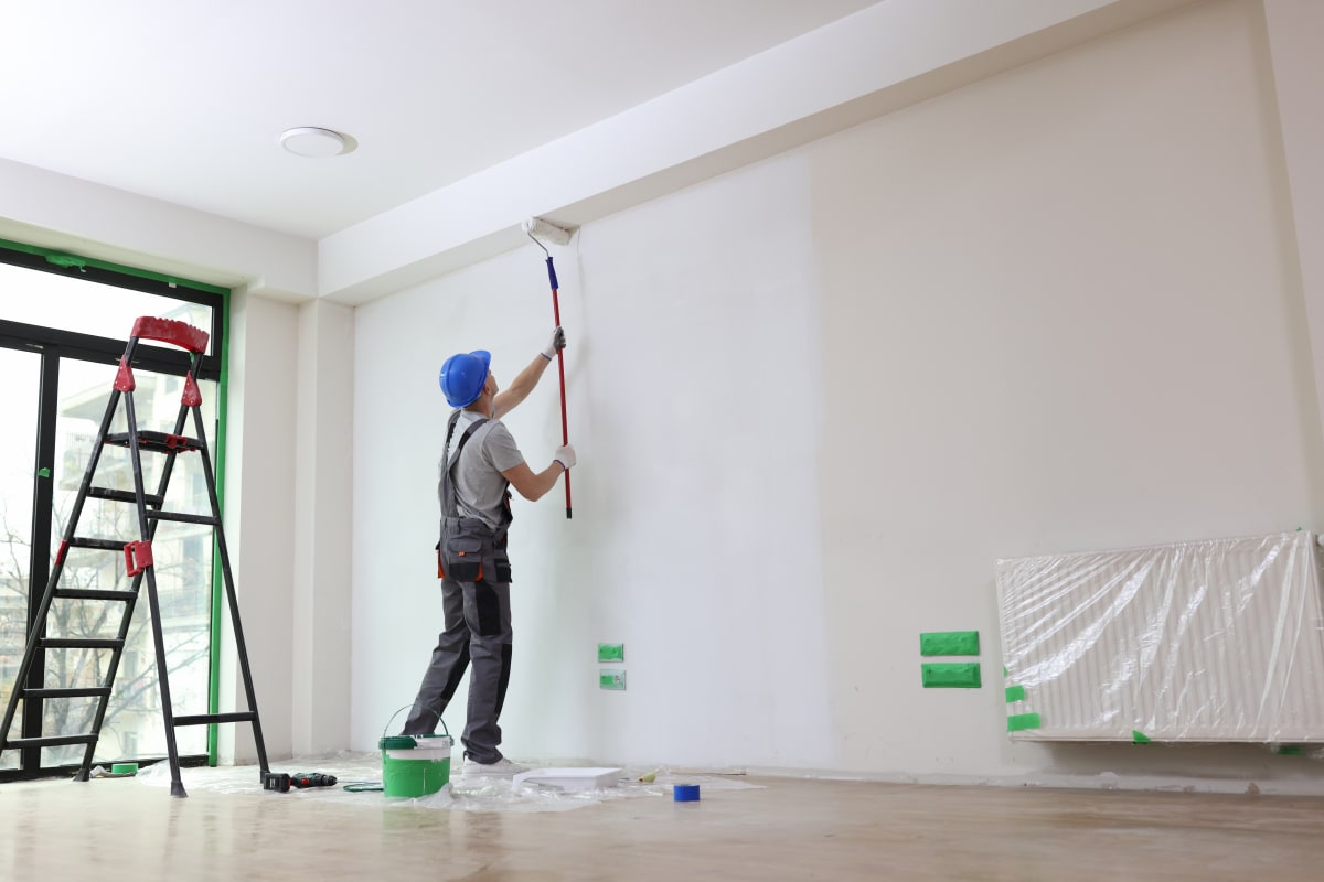 man painting wall