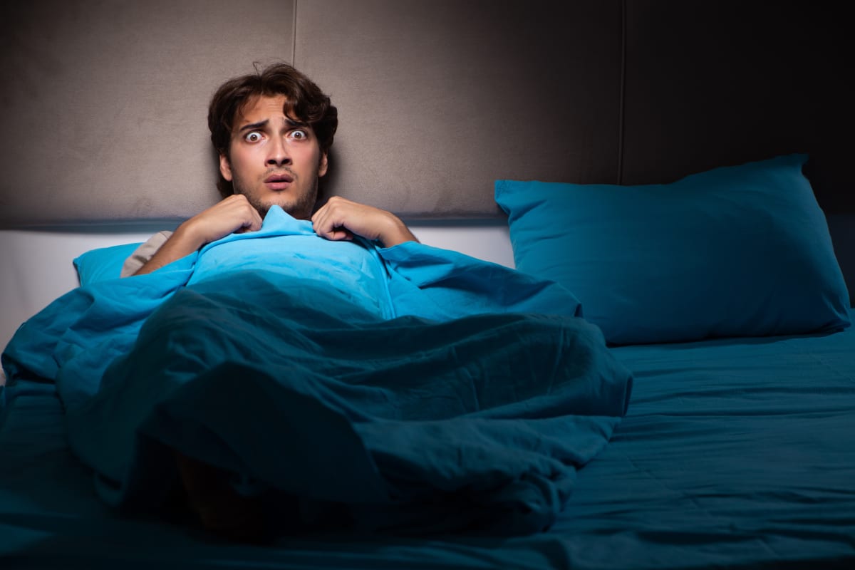 man waking from nightmare