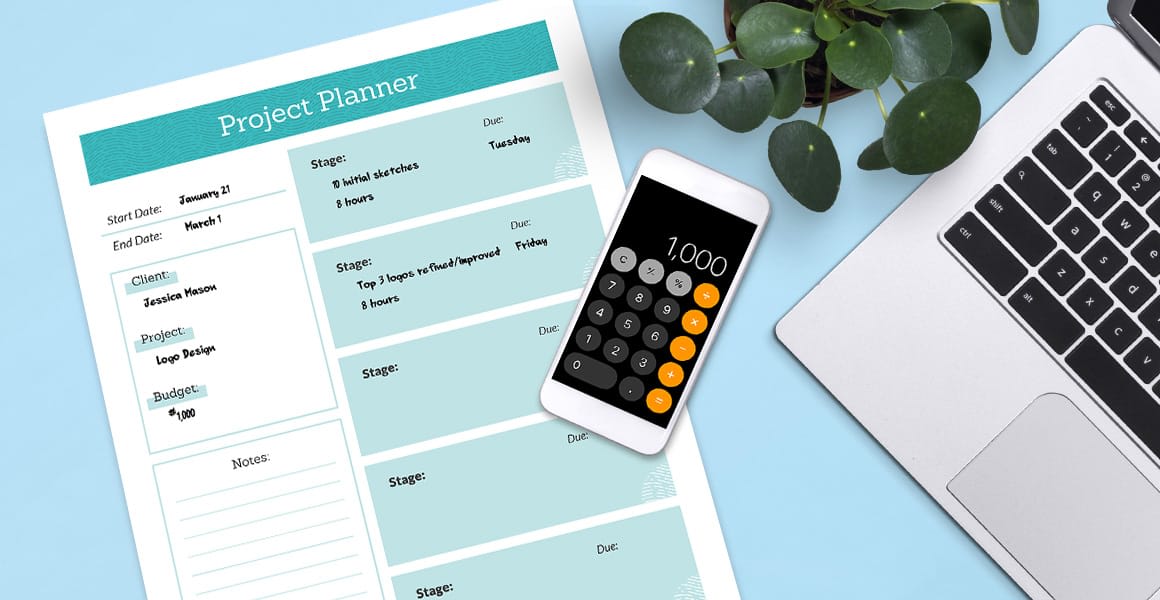 weekly planner next to a phone and a laptop.