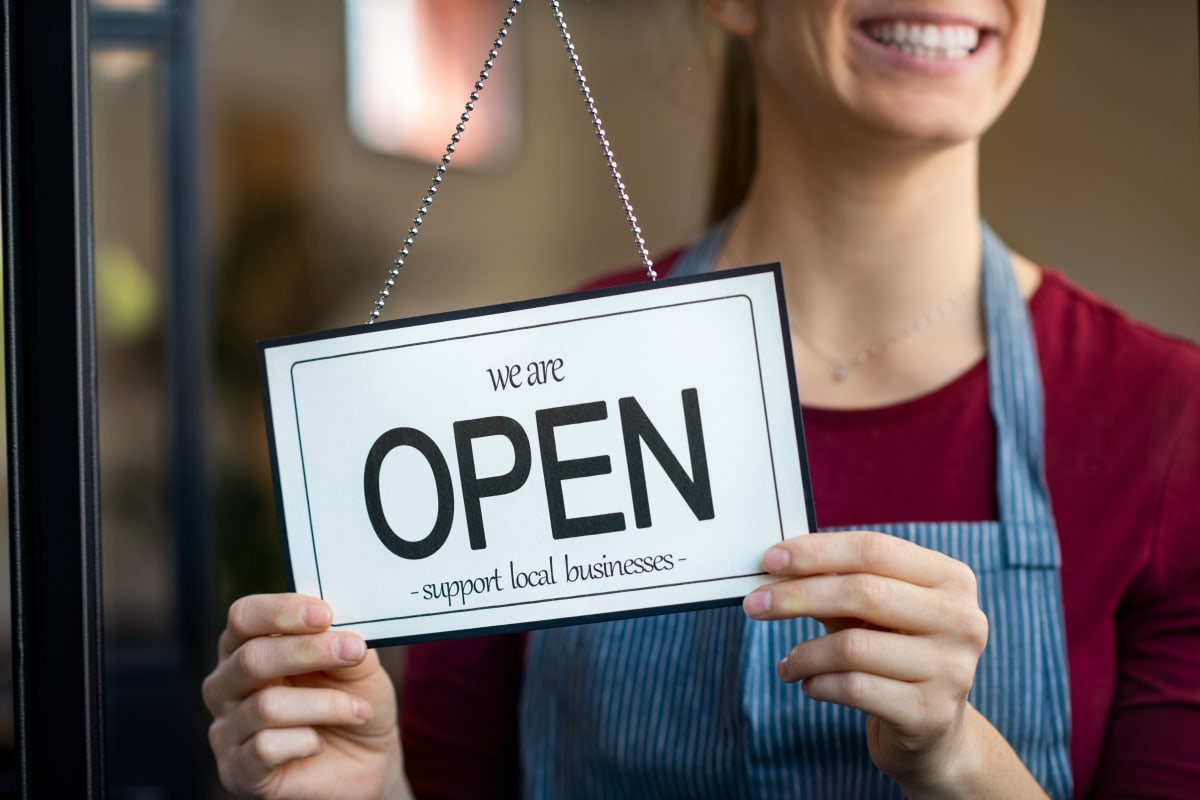 woman with open sign